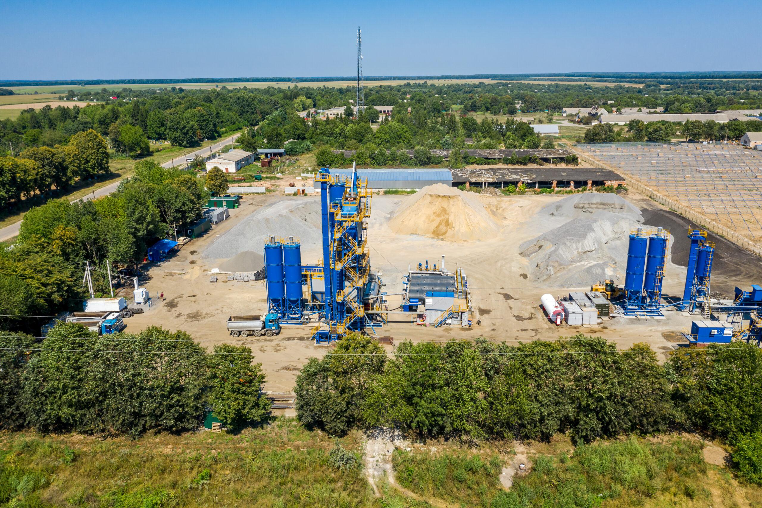 a construction site with blue and yellow structures